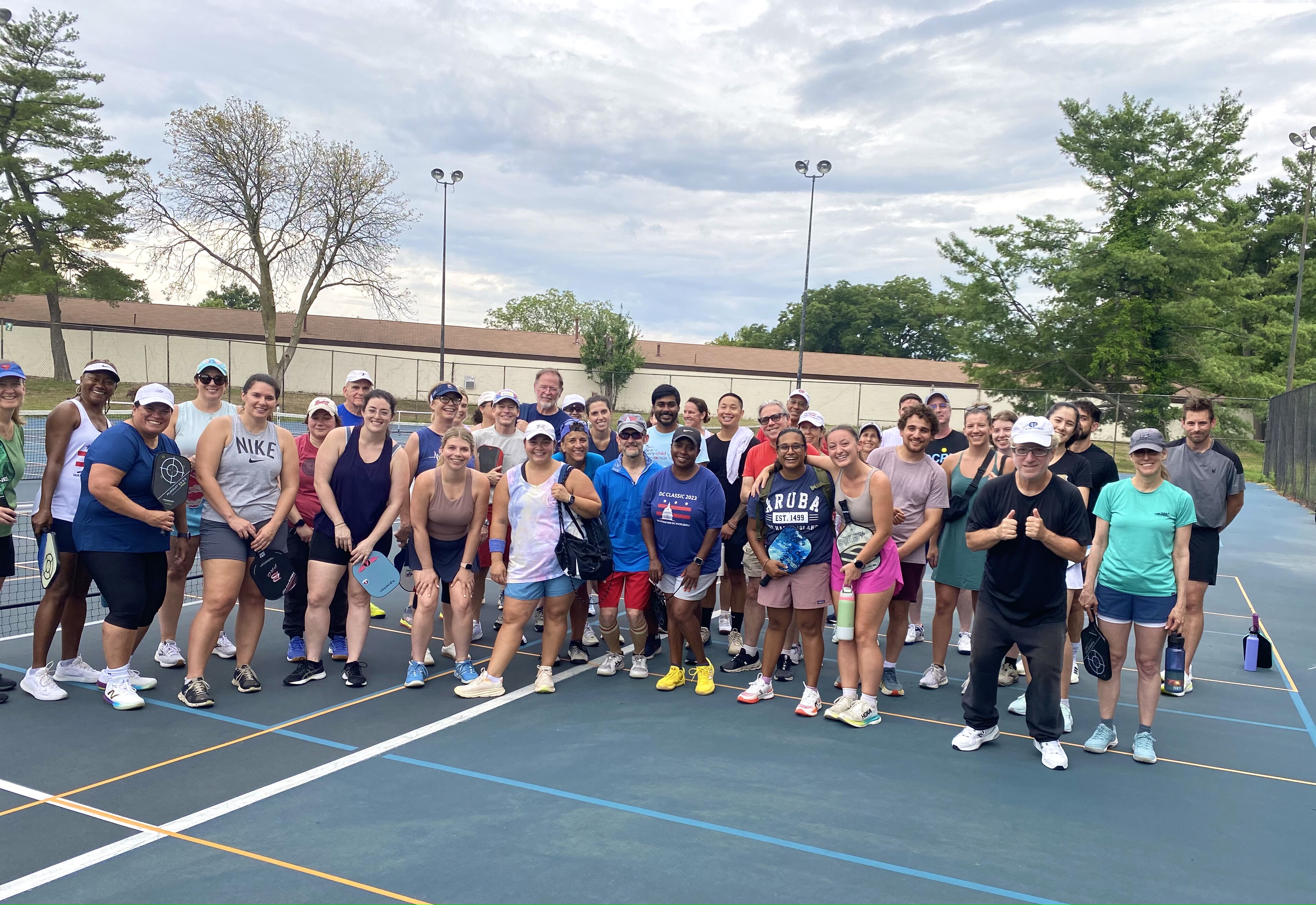 DCPL community members gathered together at a pickleball event.
