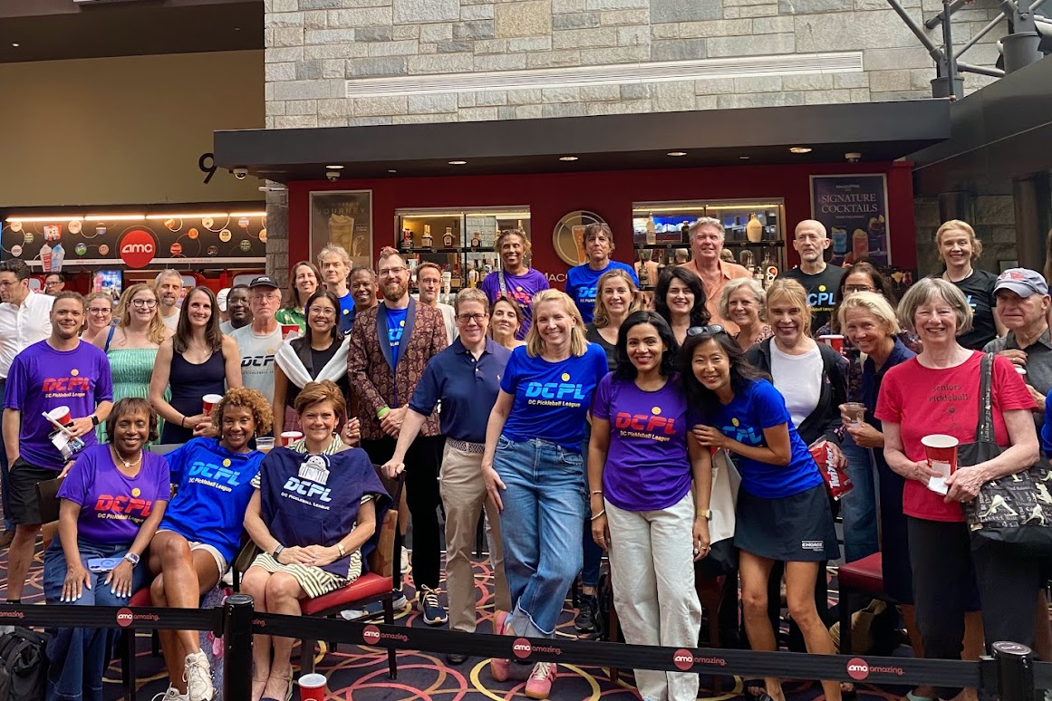 DCPL members gathering at a community movie night.